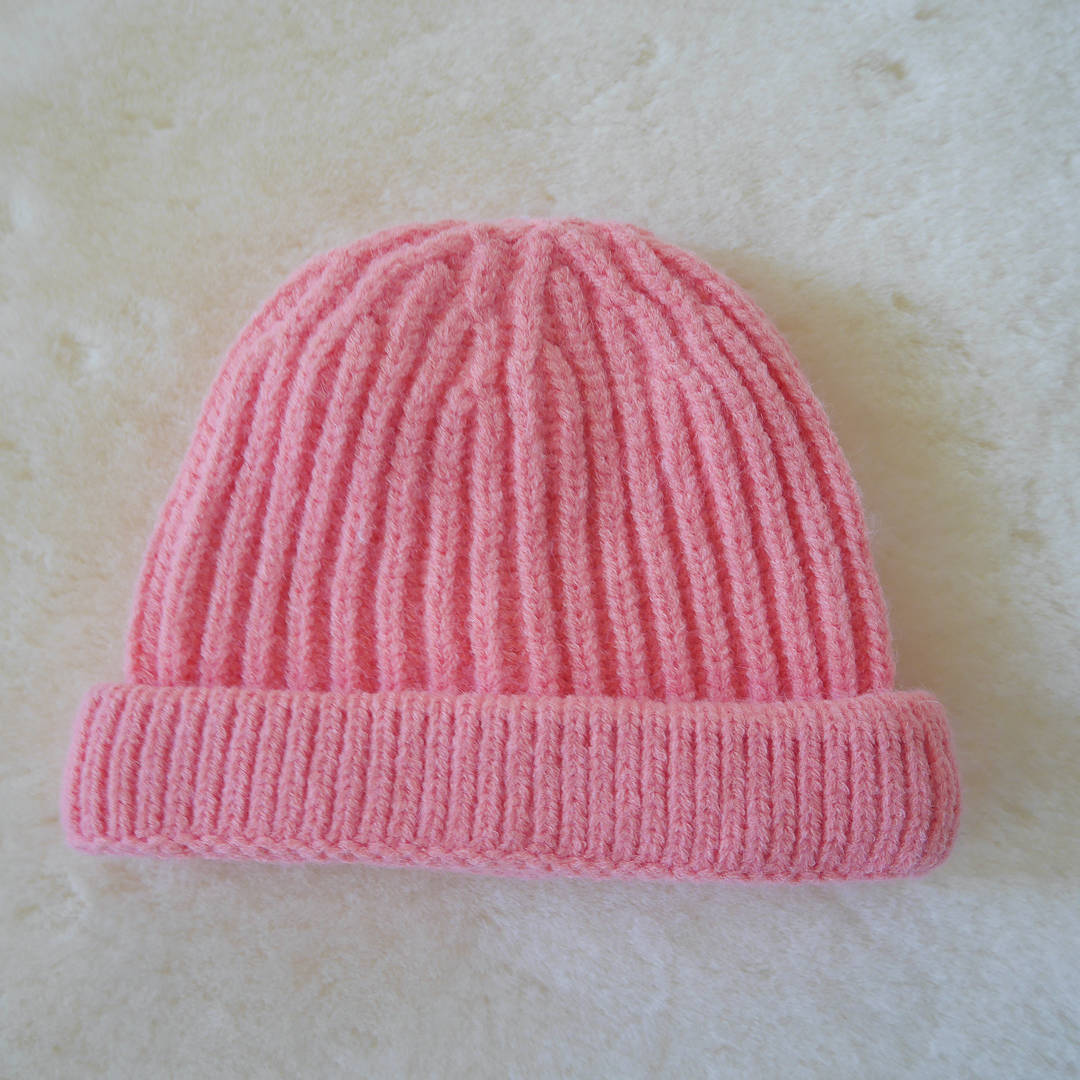 Coco & Bob - gebreide kindermuts - knalroze